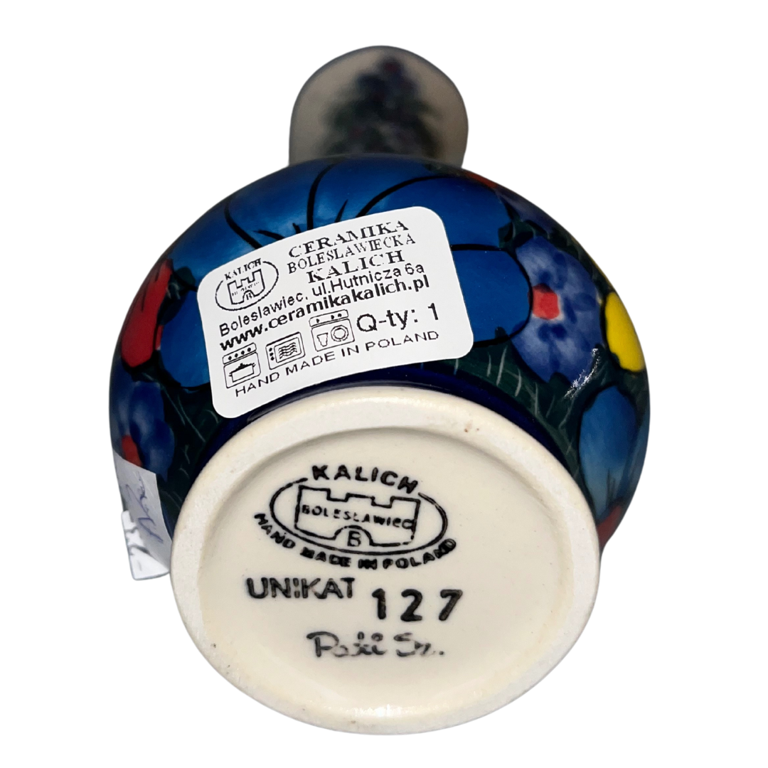 7 inch Swirl Vase Ceramika Kalich’s Pattern 127 “Wildflowers,” features blooming flowers in several color variations set against a cream and cobalt-blue background.