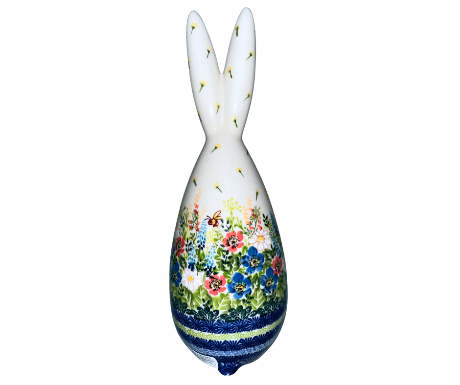 Handmade 12-inch Polish pottery bunny with blue ear bow by Ceramika Kalich. Hand-painted floral ceramic décor from Poland, perfect for Easter and spring displays.
