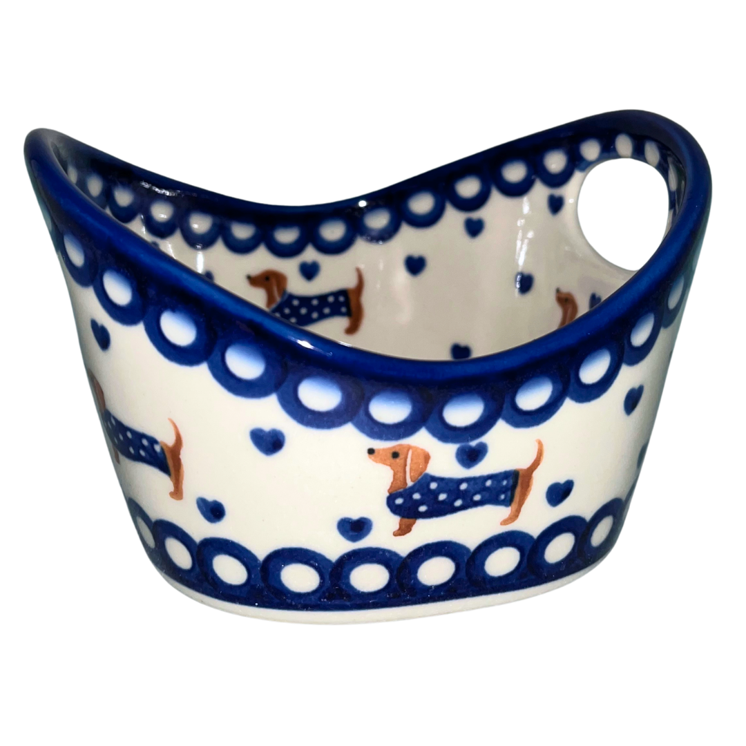 Ceramika Kalich Pattern 1322 Dachshunds features playful dachshunds in blue coats with scattered blue hearts and cobalt accents. Hand-painted Polish pottery from Poland.