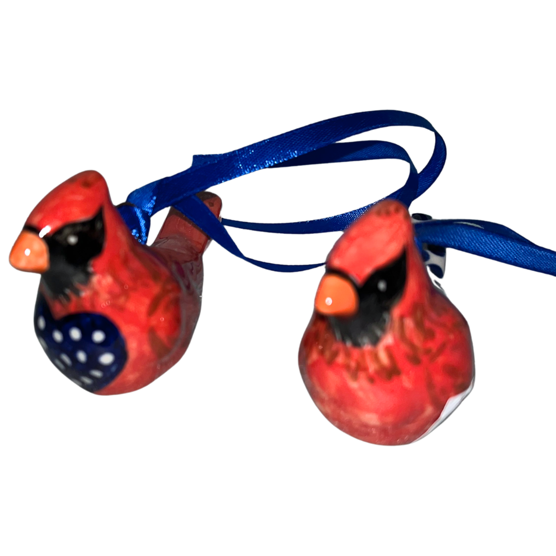 Handcrafted set of two Kalich cardinal ornaments featuring vibrant red and blue folk-art details. Perfect for holiday decorating and gifting.