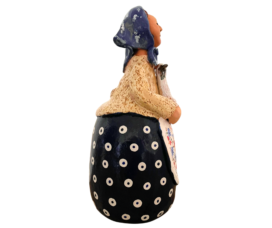 Hand-painted 12-inch Polish grandmother figurine holding a duck, wearing a traditional headscarf and floral apron.