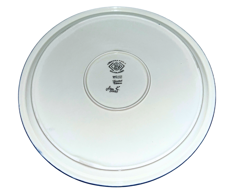 Limited edition 14.25” round charcuterie board by Kaola Studio, signed by Aga K. Features vibrant red, white & blue floral wreath with intricate cobalt mandala center.