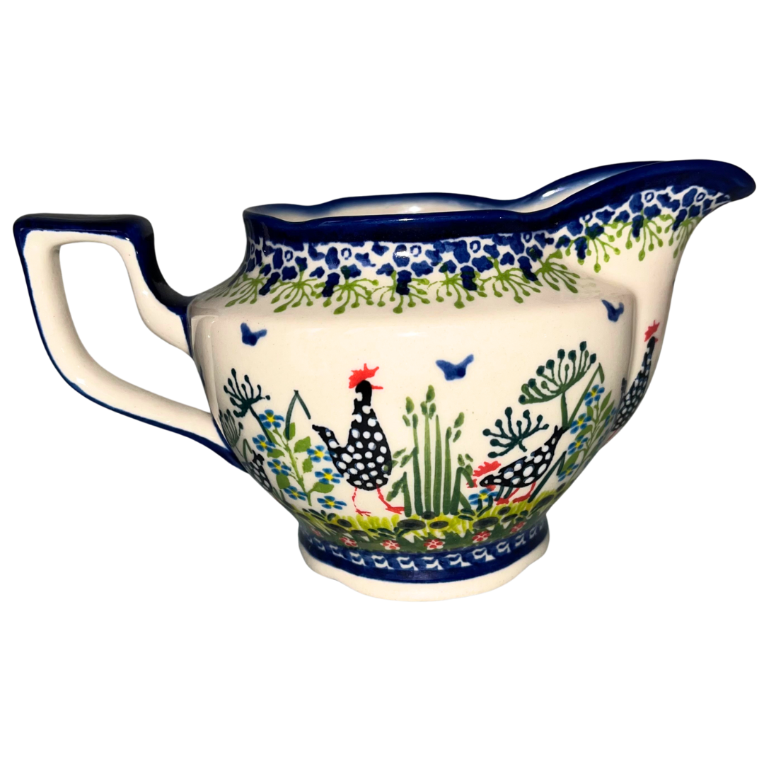Kalich Pattern 950 gravy boat with hand-painted hens and floral details. Authentic Polish stoneware, durable, oven, microwave & dishwasher safe.