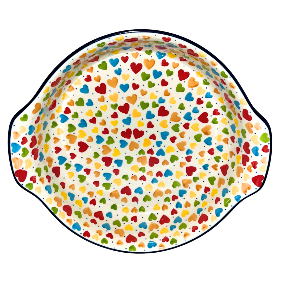 Ceramika Artystyczna Pattern U4833 Colorful Hearts features vibrant multicolored hearts on an ivory background with cobalt accents. Handcrafted Polish pottery from Bolesławiec.