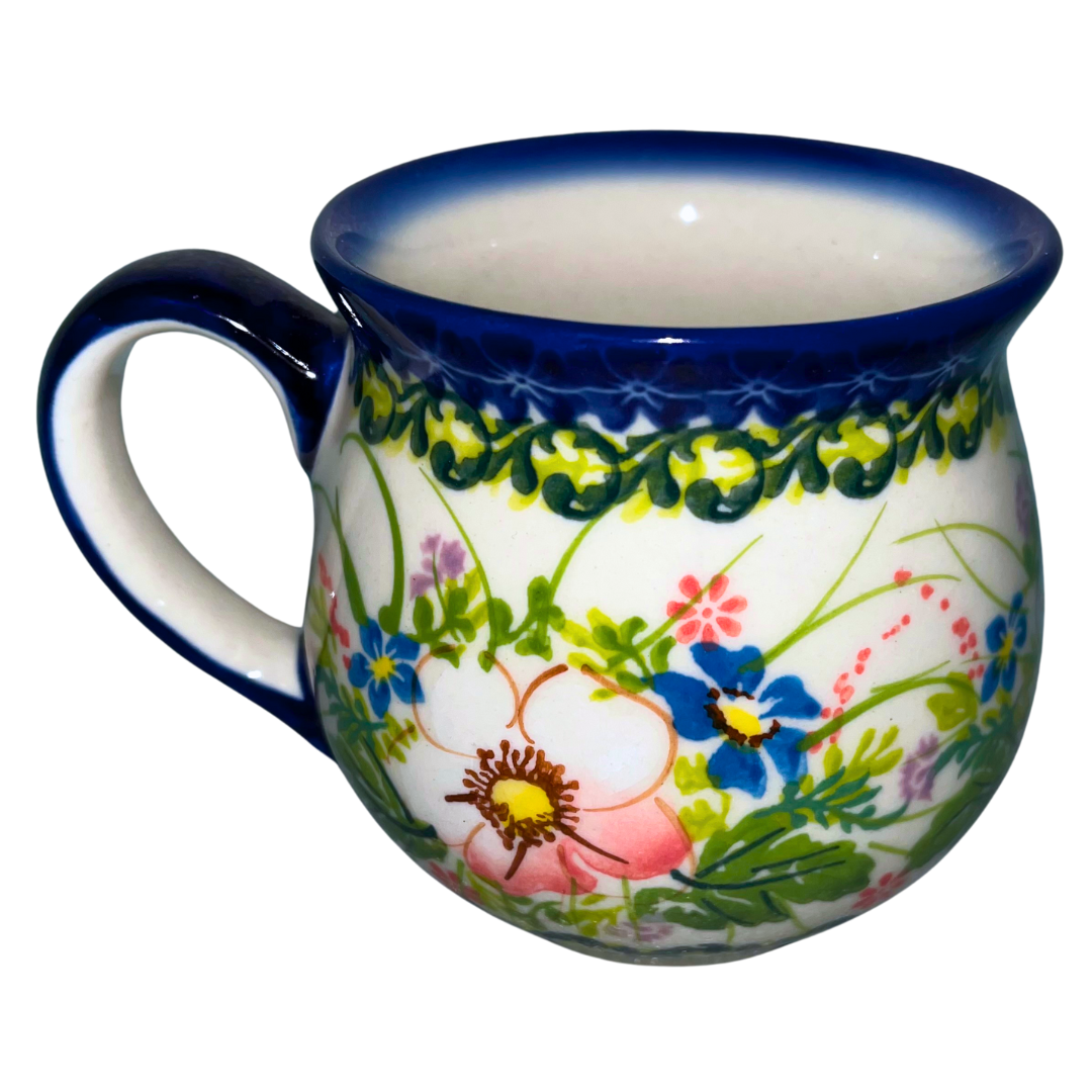 Kalich Ceramika Polish pottery Pattern 755 “Pink Ruffle” with soft pink flowers and colorful accents. Handmade stoneware, durable and dishwasher safe.
