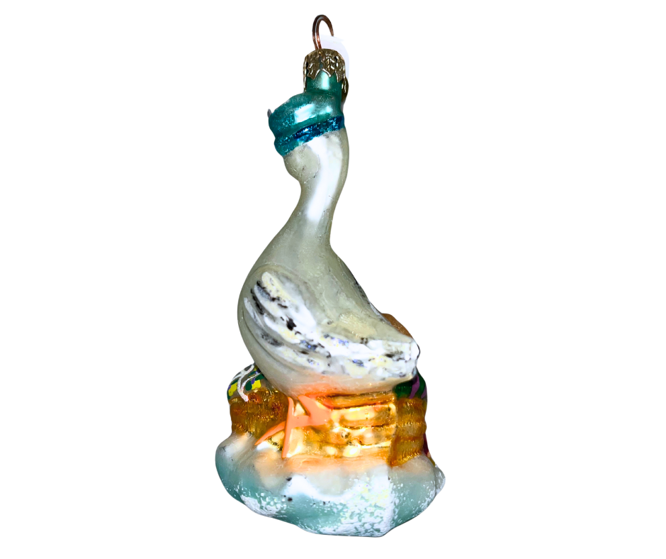 Vintage Christopher Radko “Blessed Event” glass ornament featuring a stork carrying a baby. Handcrafted European collectible celebrating new life and parenthood.