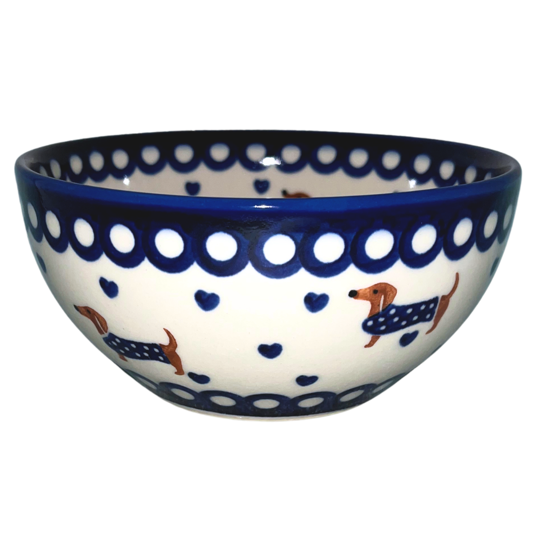 Ceramika Kalich Pattern 1322 Dachshunds features playful dachshunds in blue coats with scattered blue hearts and cobalt accents. Hand-painted Polish pottery from Poland.
