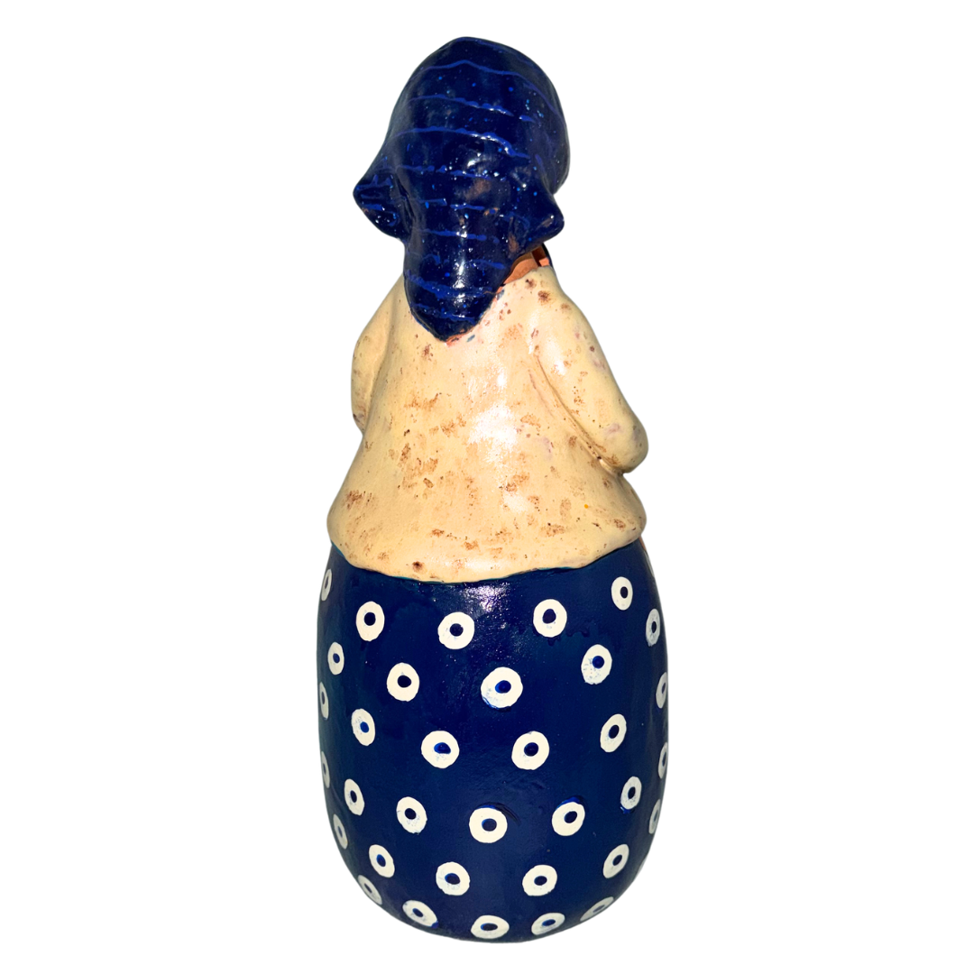 Hand-painted handcrafted babcia figurine holding a bowl of pierogi.