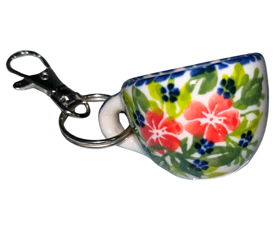 Hand-painted Polish Pottery key chain from Bolesławiec, Poland. Mini cup charm with floral design and metal clasp—perfect for keys, bags, or gifts.