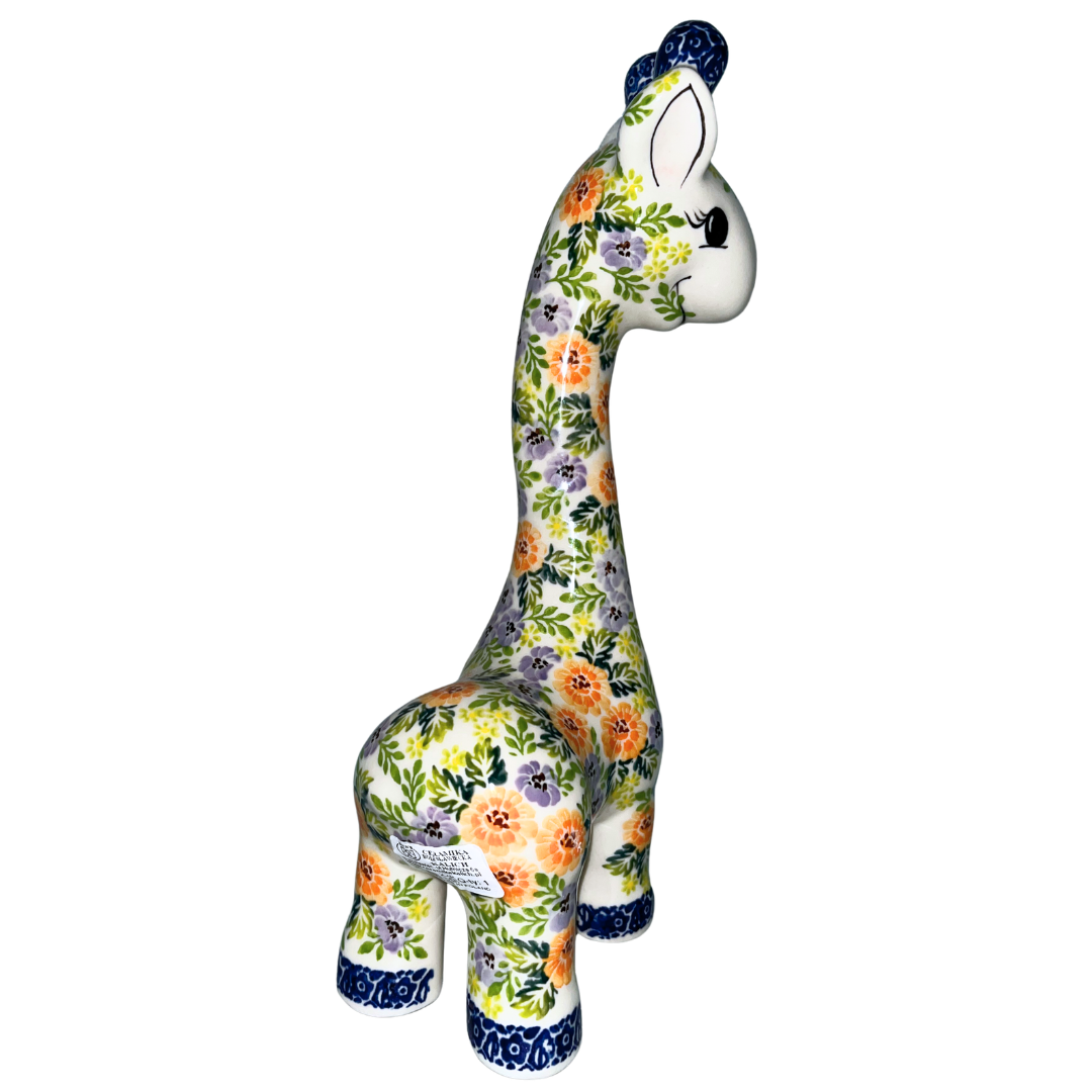 11" ceramic giraffe figurine with orange and lavender floral pattern and blue accents. Glossy finish decorative piece for home décor, nursery styling, or collectible display.