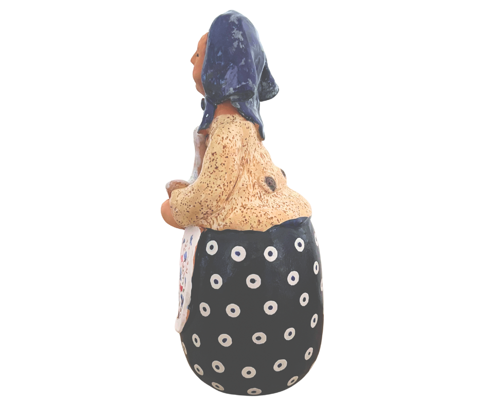 Hand-painted 12-inch Polish grandmother figurine holding a duck, wearing a traditional headscarf and floral apron. (Copy)