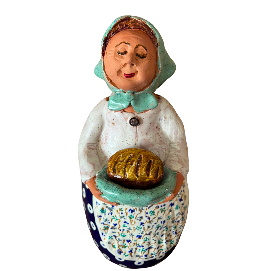 Hand-painted Polish folk art babcia grannie figurine holding a loaf of bread