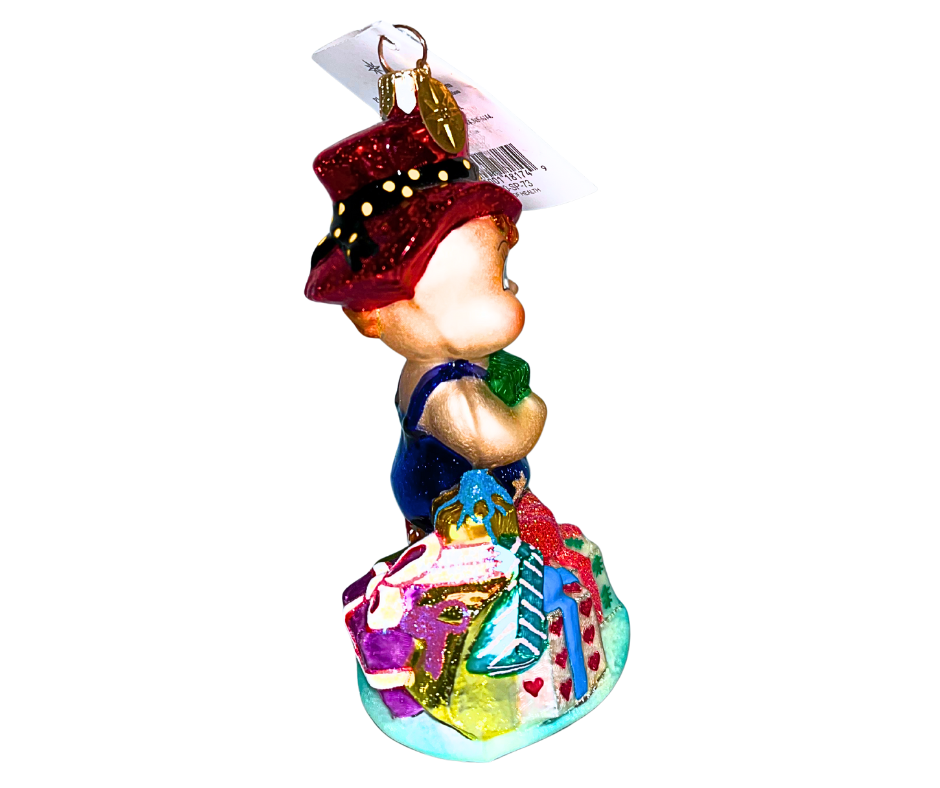 Christopher Radko “Gift of Health” #00-SP-73 hand-blown glass ornament featuring a child with gifts and red hat. Vintage collectible symbolizing care, wellness & holiday joy.