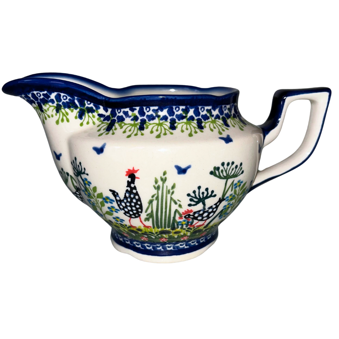 Kalich Pattern 950 gravy boat with hand-painted hens and floral details. Authentic Polish stoneware, durable, oven, microwave & dishwasher safe.