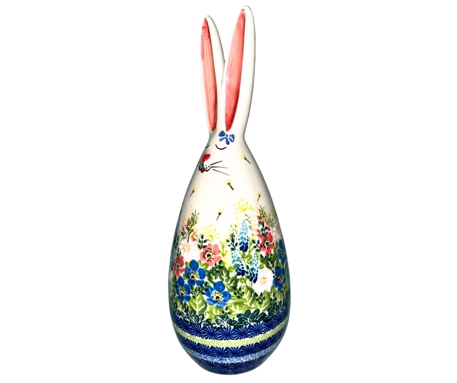 Handmade 12-inch Polish pottery bunny with blue ear bow by Ceramika Kalich. Hand-painted floral ceramic décor from Poland, perfect for Easter and spring displays.