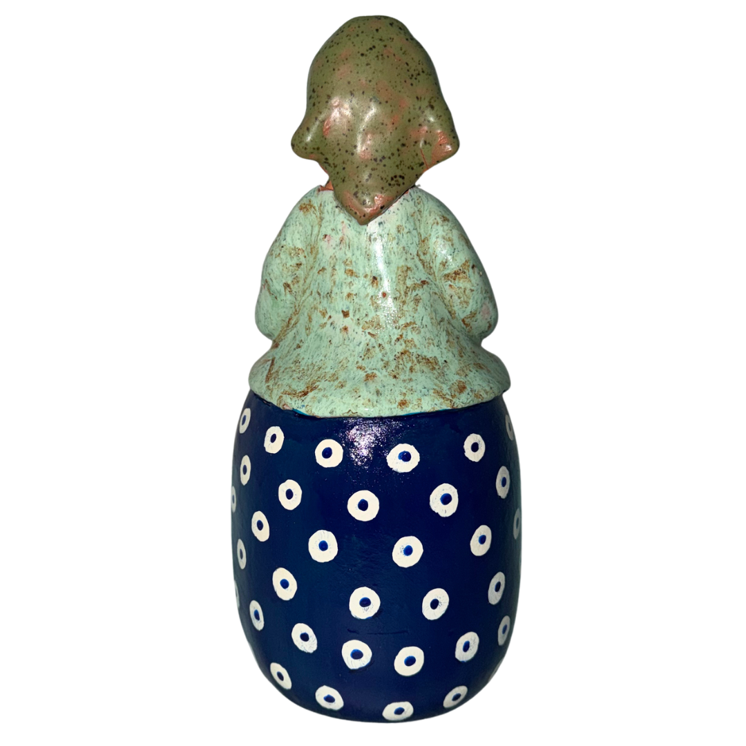 Hand-painted handcrafted babcia figurine holding a bowl of pierogi.