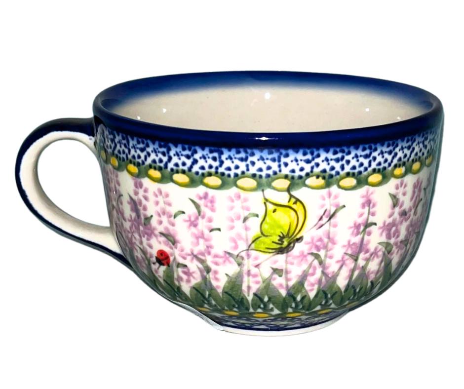 Ceramika Kalich Pattern 277 Lavender Polish pottery featuring hand-painted lavender flowers, butterflies, and ladybugs. Durable stoneware that is dishwasher, microwave, and oven safe.
