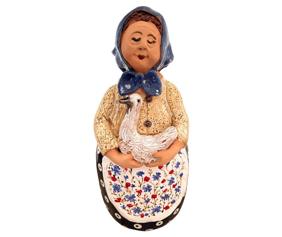 Hand-painted 12-inch Polish grandmother figurine holding a duck, wearing a traditional headscarf and floral apron.