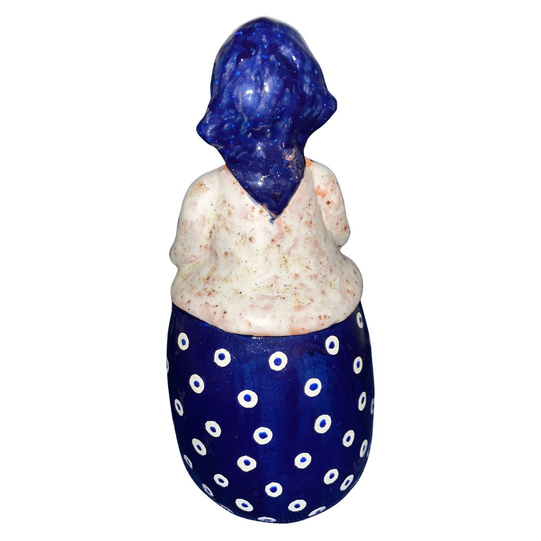 Hand-painted folk art babcia grannie figurine holding a bowl of fresh eggs
