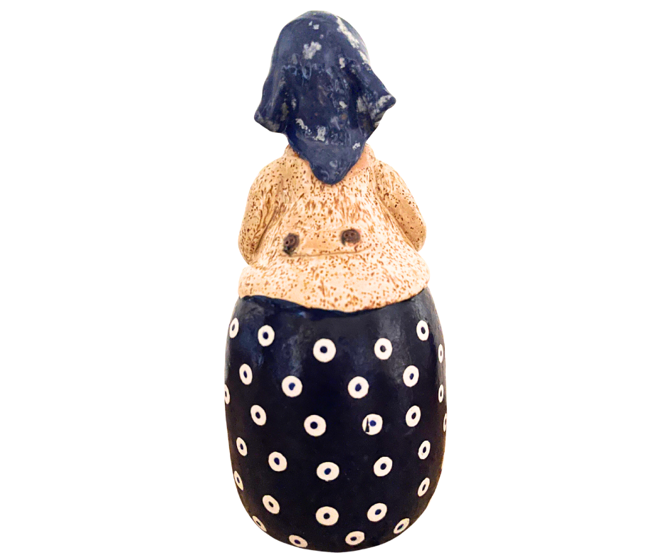Hand-painted 12-inch Polish grandmother figurine holding a duck, wearing a traditional headscarf and floral apron.