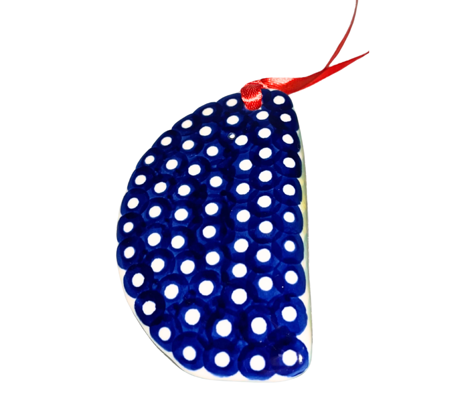 Handmade Polish Pottery pierogi ornament by Kaola Studio featuring a hand-painted orange flower and classic blue dot pattern. A unique Polish folk art collectible.