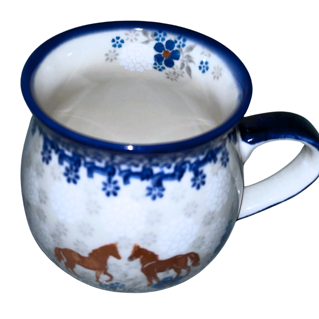 Ceramika Kalich Pattern 1311 features two horses among vibrant blue blossoms with a classic cobalt border. Hand-painted Polish pottery from Bolesławiec, Poland.