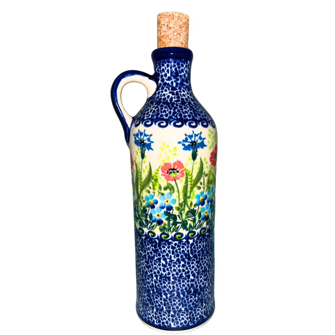 Hand-painted Kalich Polish pottery 9 inch bottle featuring wildflowers, poppies, and forget-me-nots. Durable stoneware, dishwasher, microwave, and oven safe.