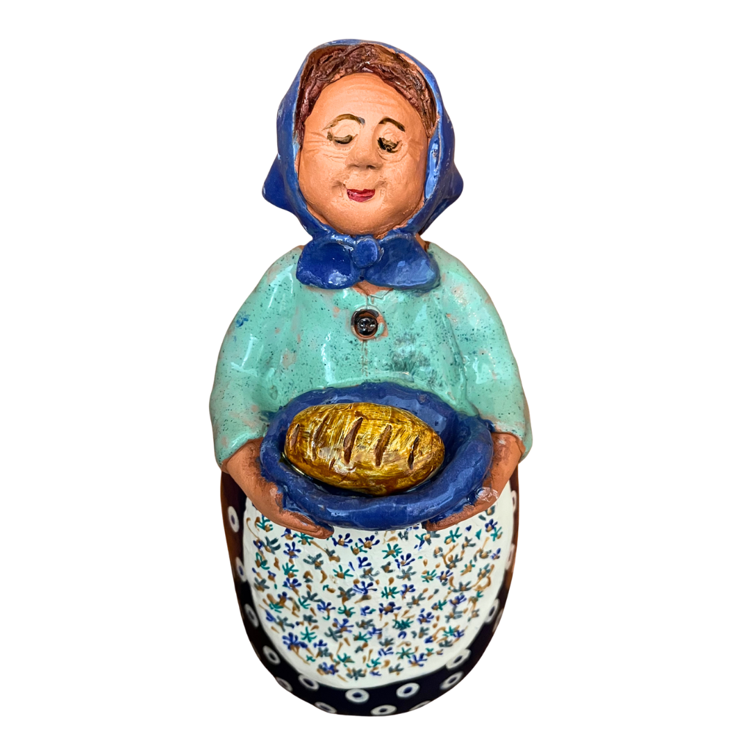 Hand-painted Polish folk art babcia grannie figurine holding a loaf of bread