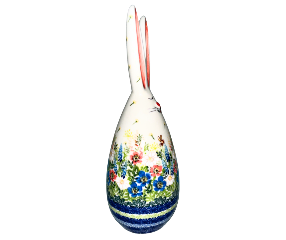 Handmade 12-inch Polish pottery bunny with blue ear bow by Ceramika Kalich. Hand-painted floral ceramic décor from Poland, perfect for Easter and spring displays.