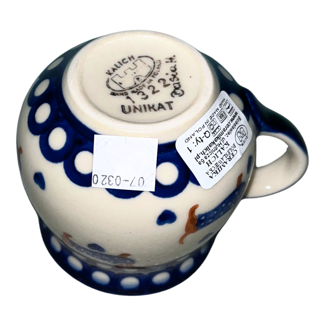 Ceramika Kalich Pattern 1322 Dachshunds features playful dachshunds in blue coats with scattered blue hearts and cobalt accents. Hand-painted Polish pottery from Poland.