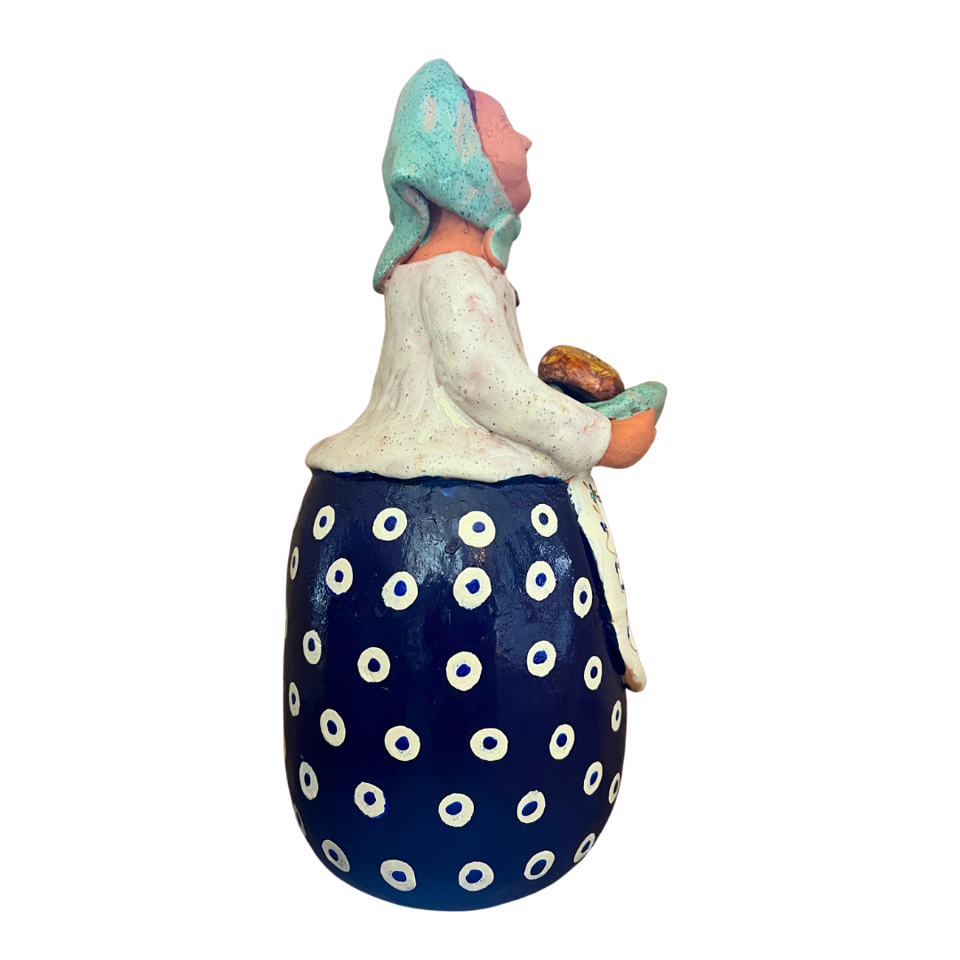 Hand-painted Polish folk art babcia grannie figurine holding a loaf of bread