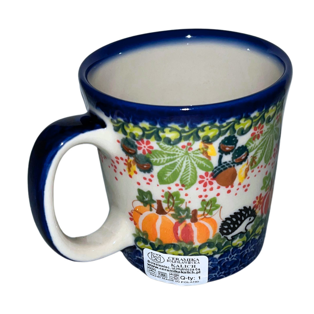 Kalich Polish Pottery Hedgehog Pumpkins Acorns pattern 1103 features hand-painted hedgehogs, pumpkins, and acorns in a vibrant autumn design on durable stoneware.