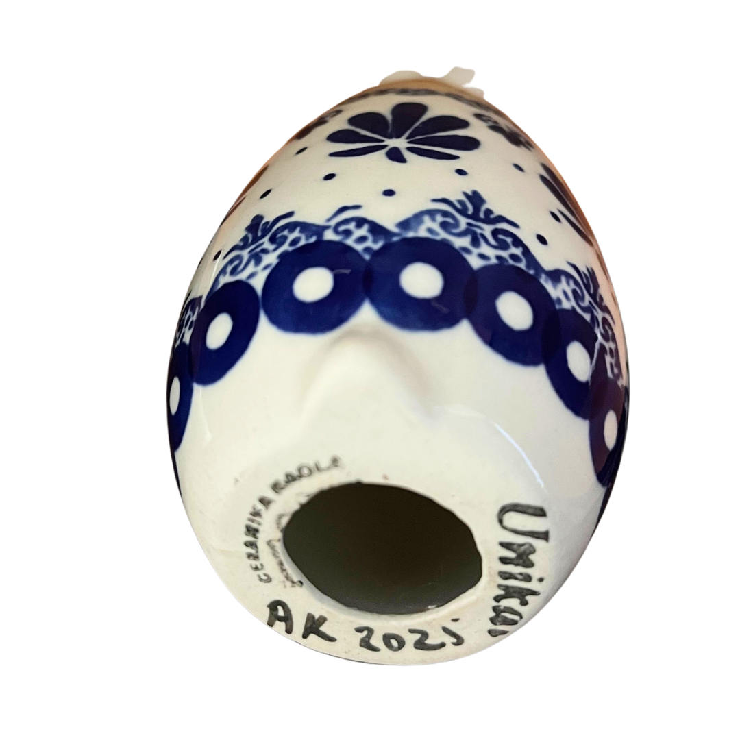 5.75" Polish pottery bunny by Kaola, hand-painted in cobalt patterns & peach accents, signed A K. Glossy, durable, collectible ceramic figurine.