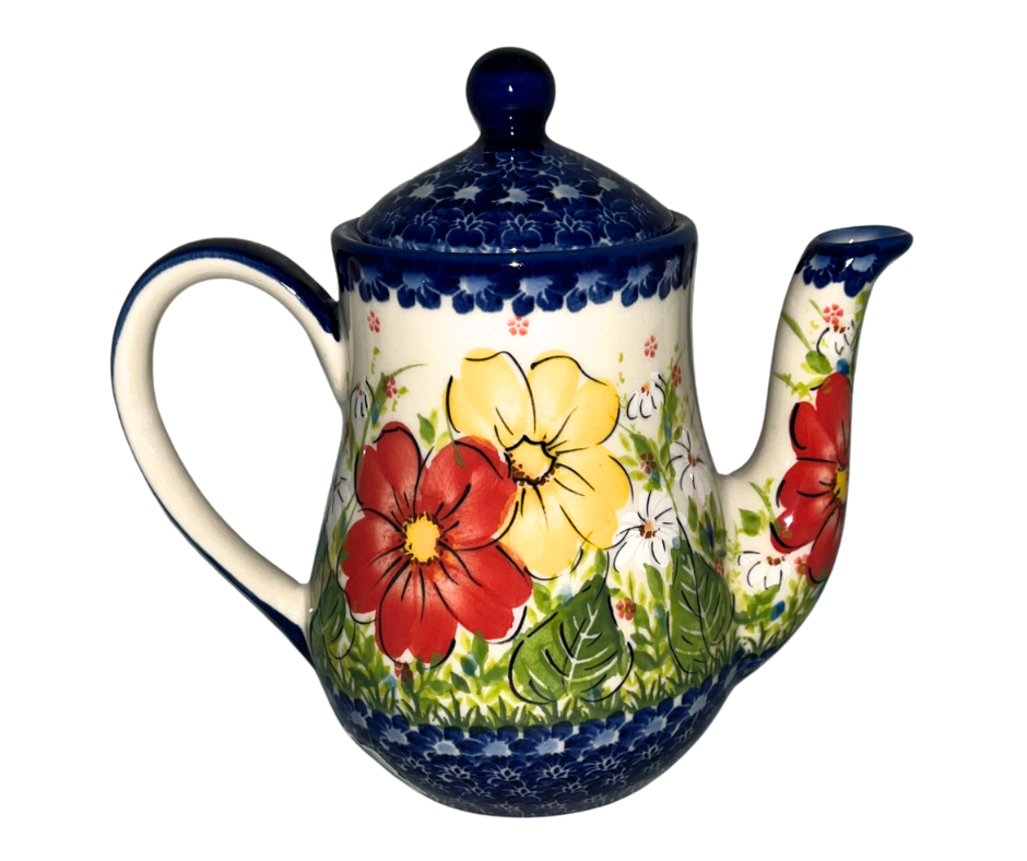 Kalich Polish Pottery floral pattern with red and yellow blossoms, white accents, and green foliage on cream with cobalt rim; hand-painted meadow design with light, airy composition