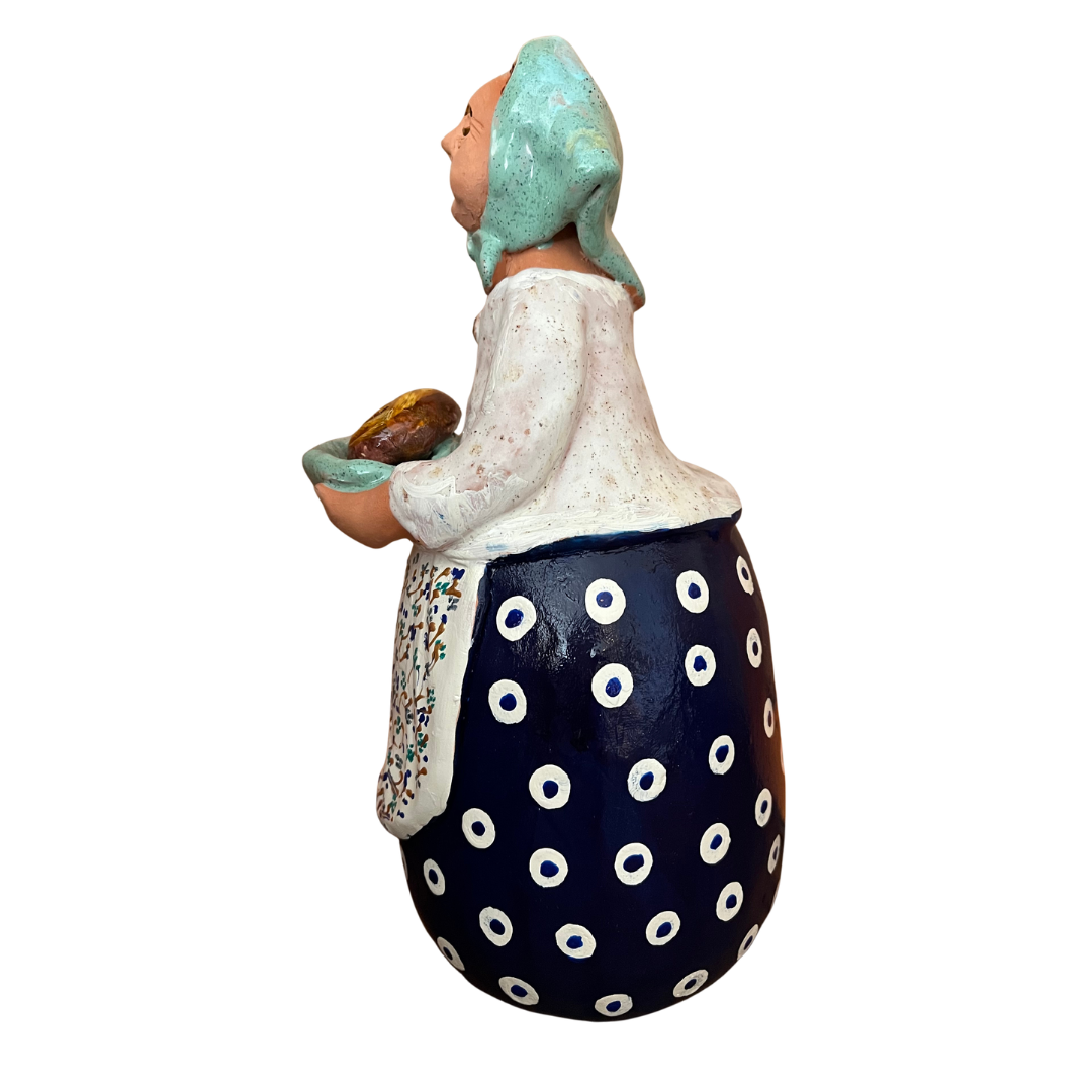 Hand-painted Polish folk art babcia grannie figurine holding a loaf of bread