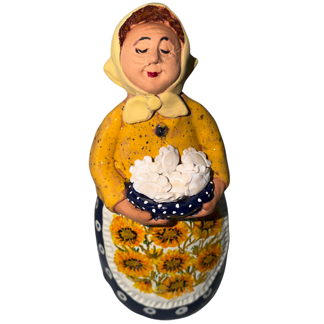 Hand-painted handcrafted babcia figurine holding a bowl of pierogi. (Copy)