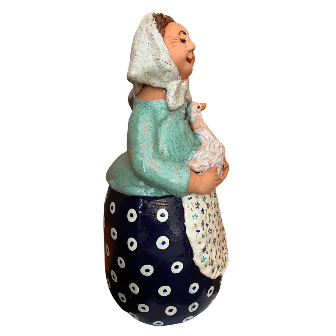 Hand-painted folk art babcia grannie figurine holding a duck