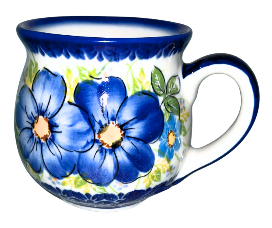 Babcia Polish Pottery Mug – 10 oz Hand-painted Polish Pottery mug featuring “Babcia” text and blue floral design. Handmade in Bolesławiec, Poland. Dishwasher & microwave safe.