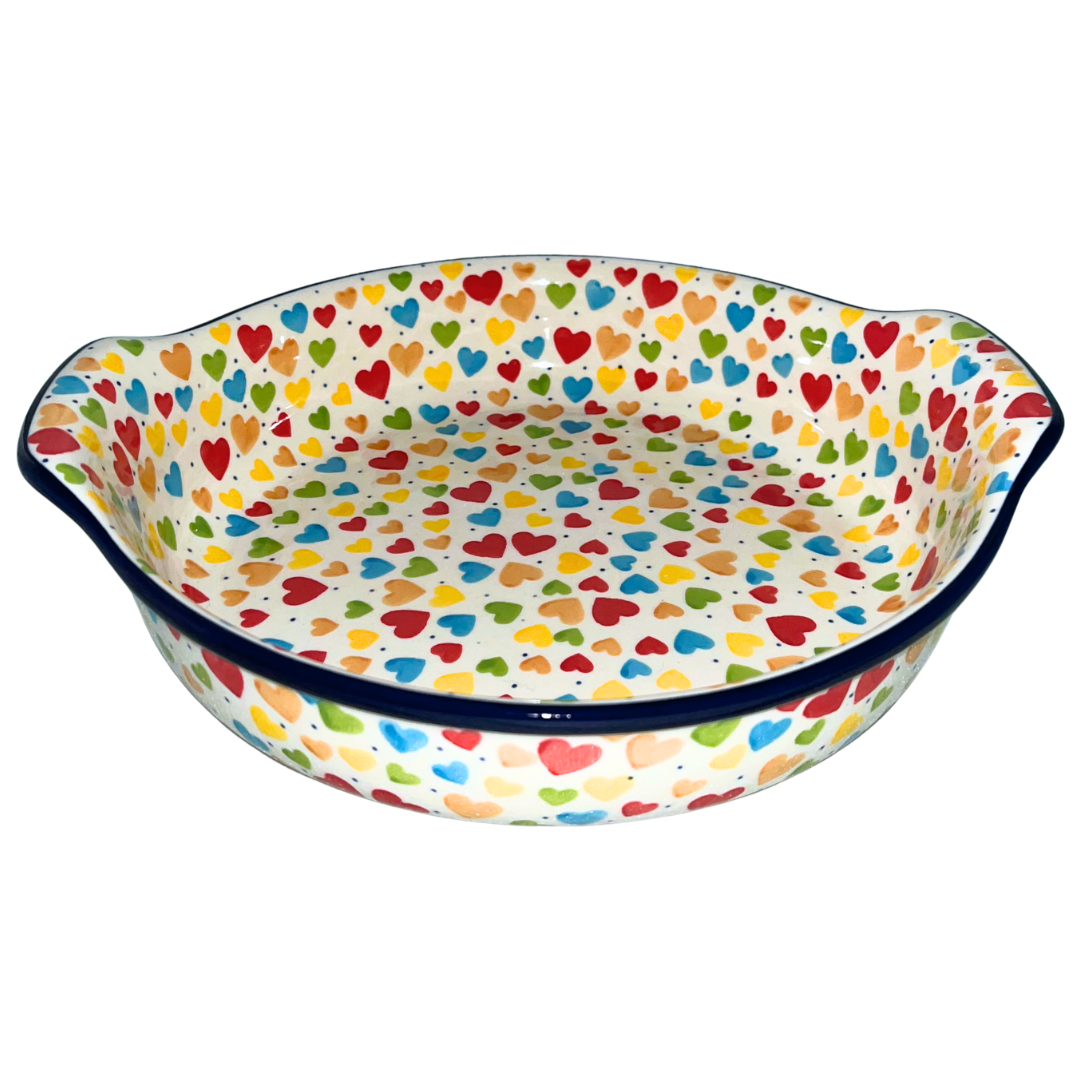 Ceramika Artystyczna Pattern U4833 Colorful Hearts features vibrant multicolored hearts on an ivory background with cobalt accents. Handcrafted Polish pottery from Bolesławiec.
