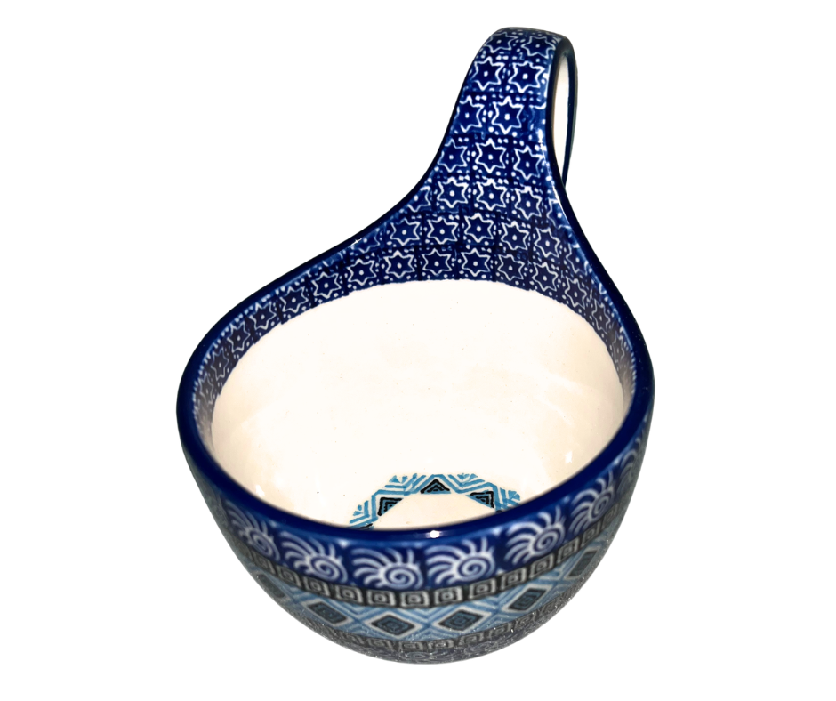 Ceramika Artystyczna 1917X Aztec Sky features geometric blue, white, and black bands with diamond and spiral motifs; hand-painted modern Polish pottery design with bold symmetry.