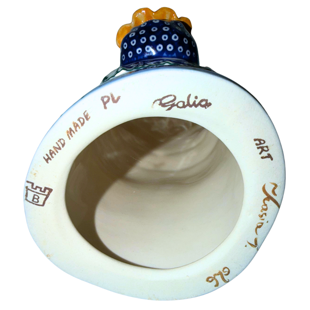 Galia Polish Pottery Babcia holding a bowl of pierogi. 9-inch handmade and hand-painted Polish Grannie figurine from the Bolesławiec region of Poland.