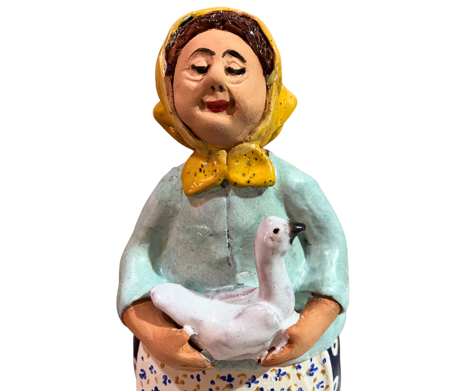 Hand-painted babcia grannie figurine holding a duck, wearing a pink scarf and floral apron