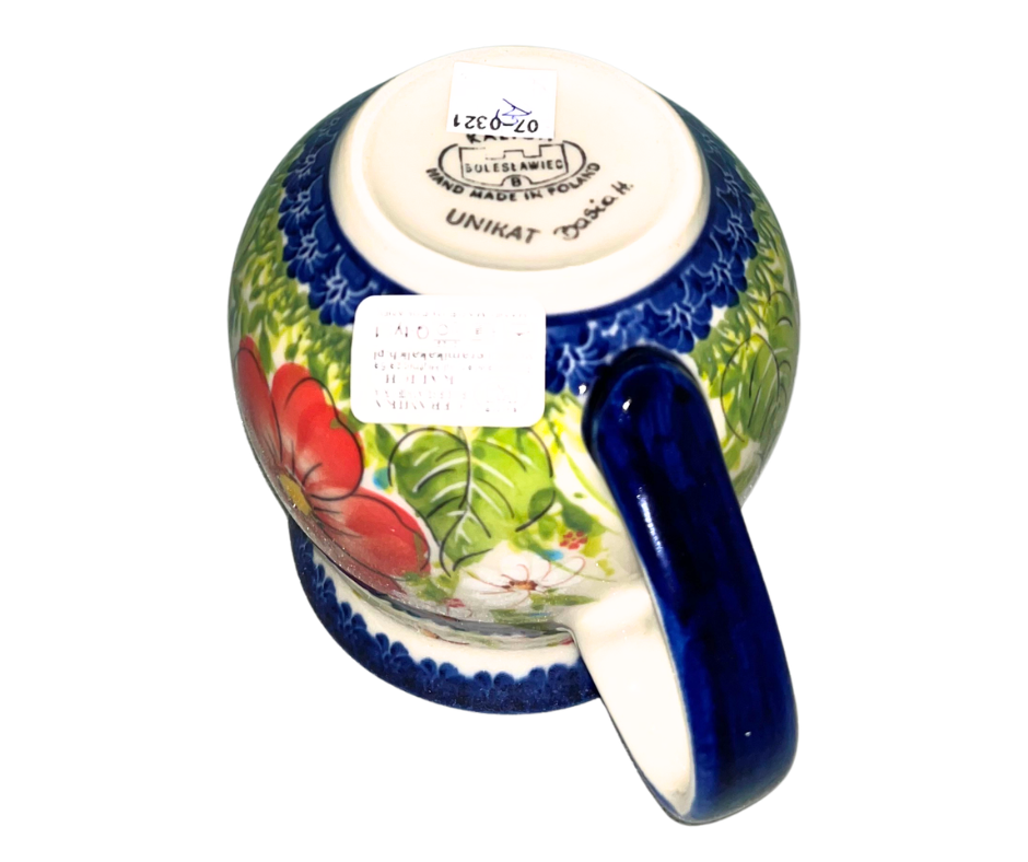 Kalich Polish Pottery floral pattern with red and yellow blossoms, white accents, and green foliage on cream with cobalt rim; hand-painted meadow design with light, airy composition. (Copy)