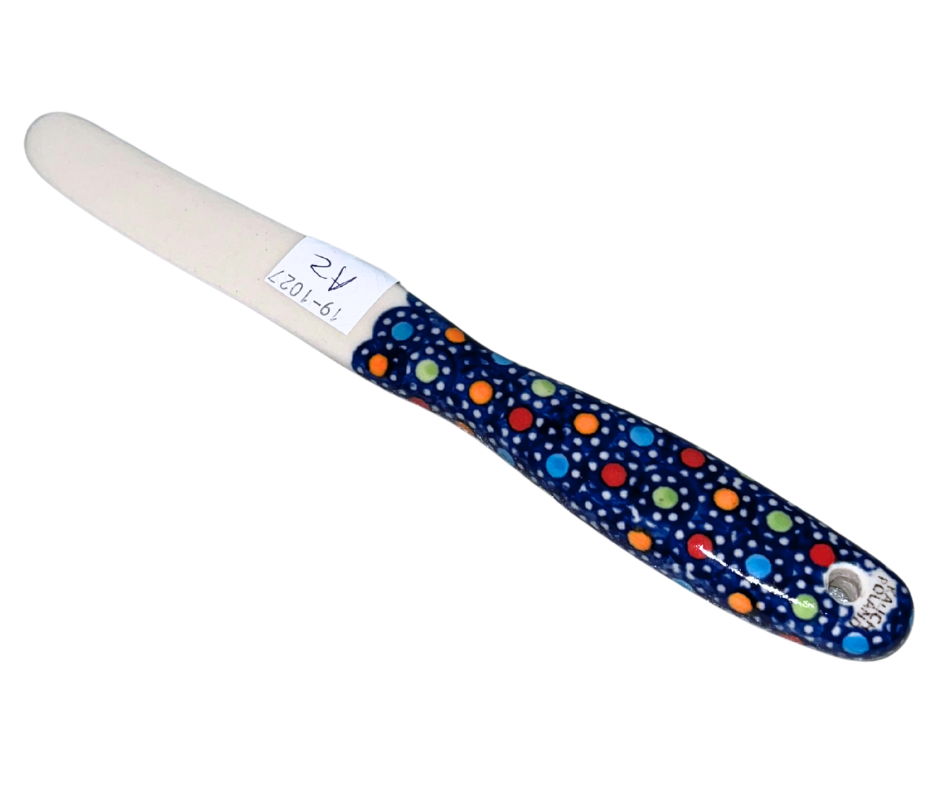 Kalich Polish Pottery knife spreader in Pattern 400 Polka Dots. Hand-painted in Poland with cheerful multicolor dots on cobalt blue. Durable, food-safe, and dishwasher safe.