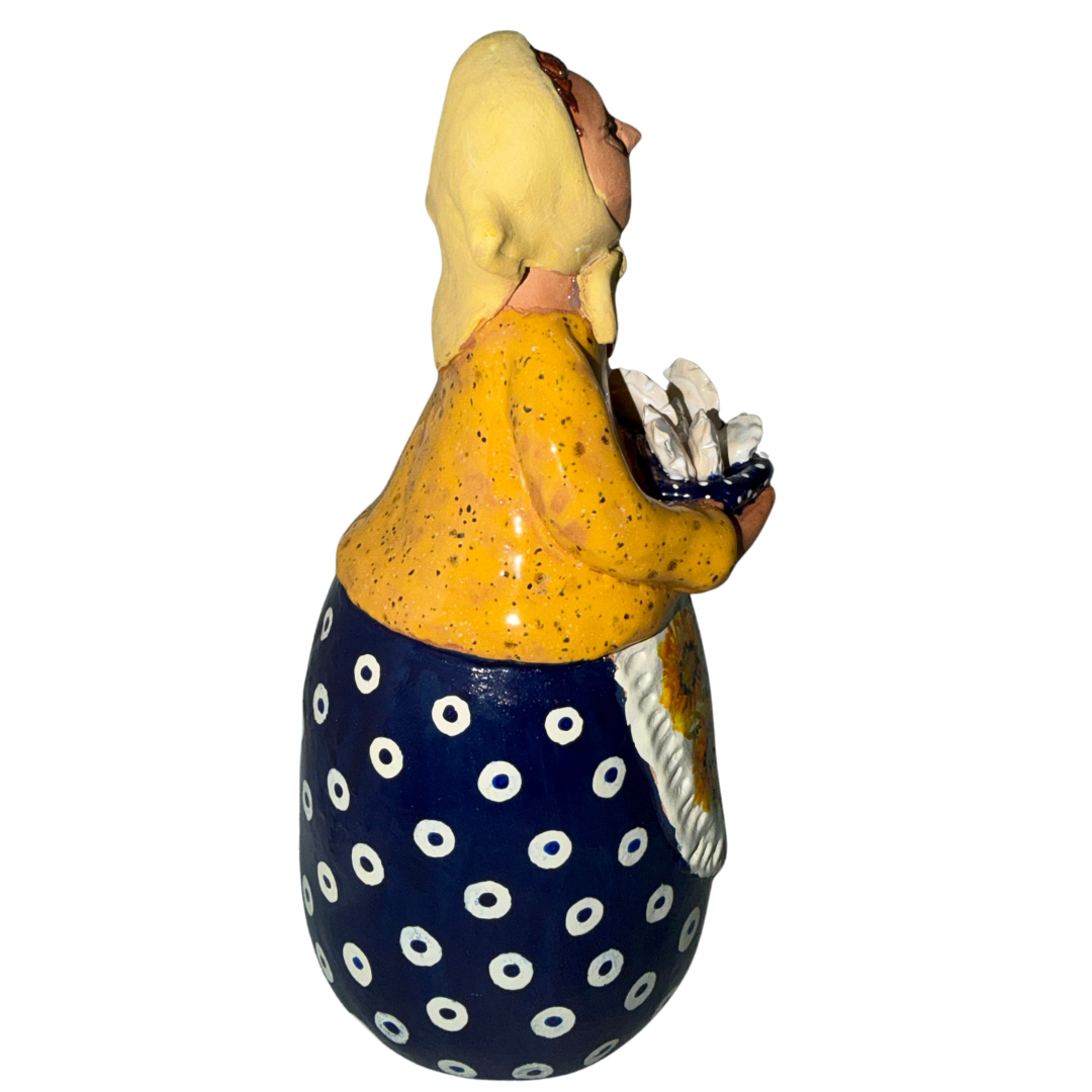 Hand-painted handcrafted babcia figurine holding a bowl of pierogi. (Copy)