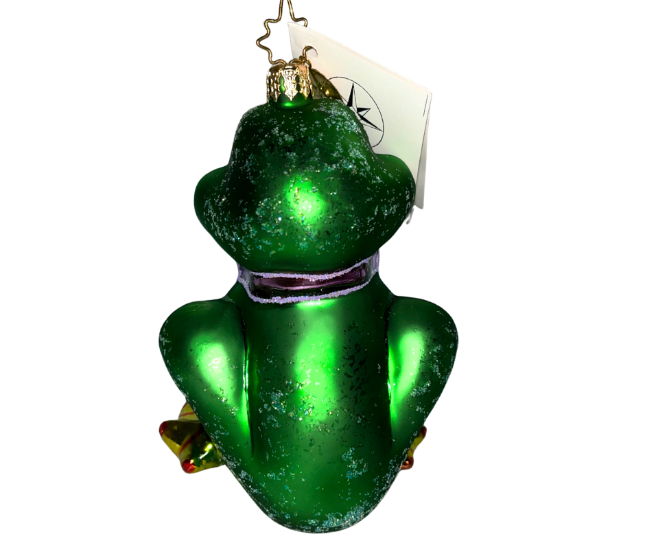 Cheerful green frog ornament by Christopher Radko. Hand-painted glass collectible, made in Poland—adds playful sparkle and charm to your Christmas tree.