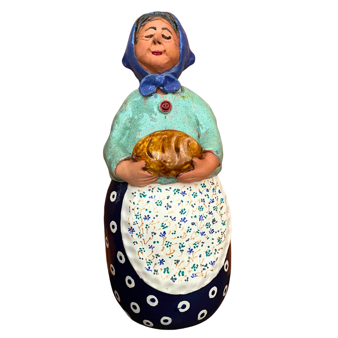Hand-painted Polish folk art babcia grannie figurine holding a loaf of bread