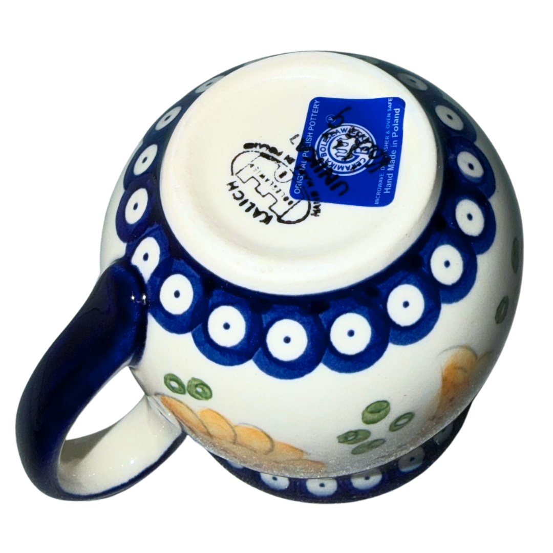 Ceramika Kalich Polish Pottery Pattern 1447 Pierogis bubble mug, hand-painted with golden pierogi, green accents and a cobalt blue border.