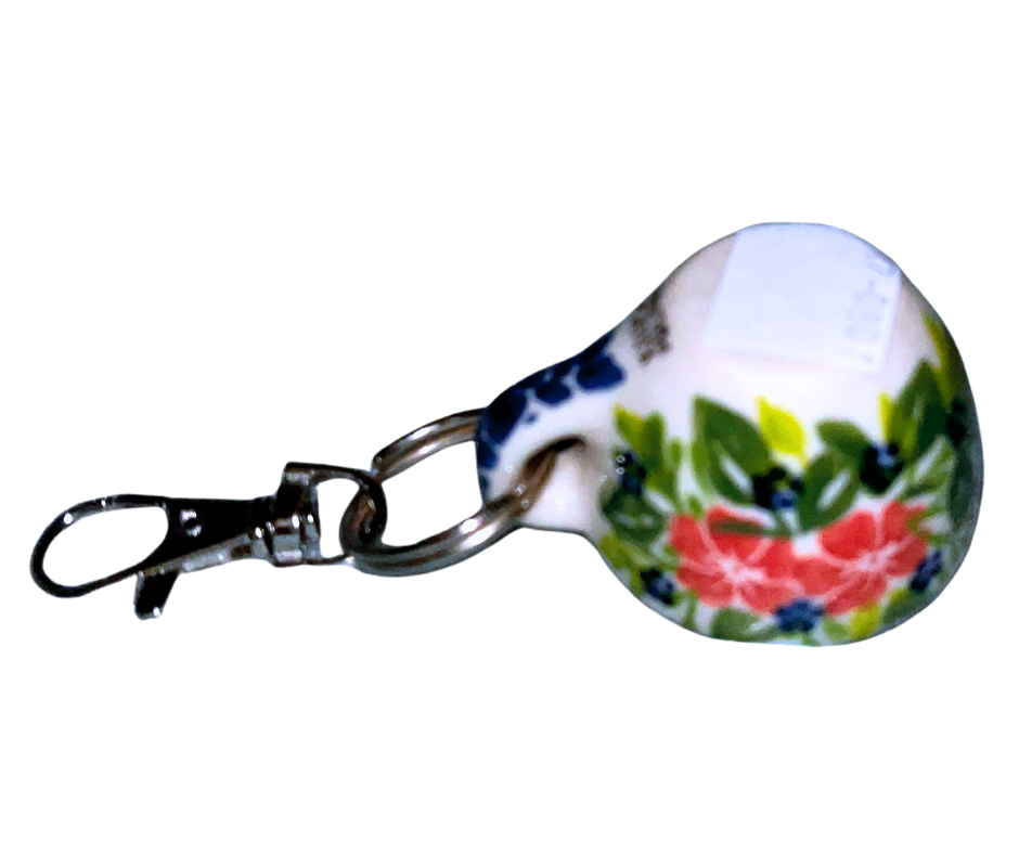 Hand-painted Polish Pottery key chain from Bolesławiec, Poland. Mini cup charm with floral design and metal clasp—perfect for keys, bags, or gifts.
