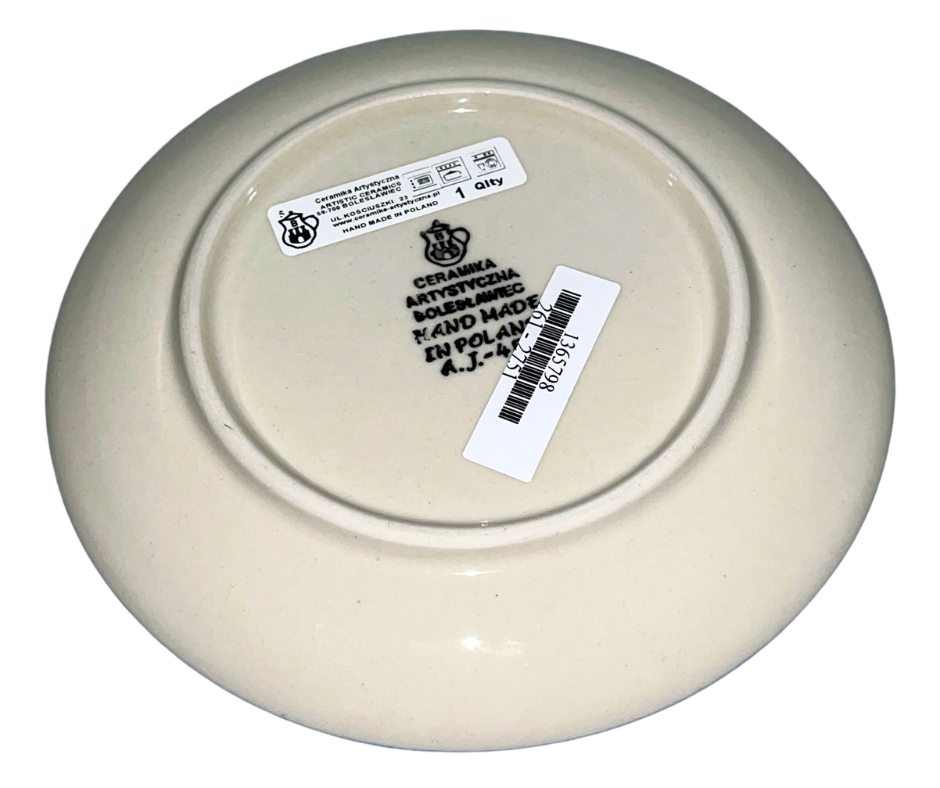 Ceramika Artystyczna Polish pottery pattern 2751X “Blue Orchids.” Hand-decorated Bolesławiec stoneware featuring blue orchid motifs, cobalt medallion center, and traditional stamped border design.